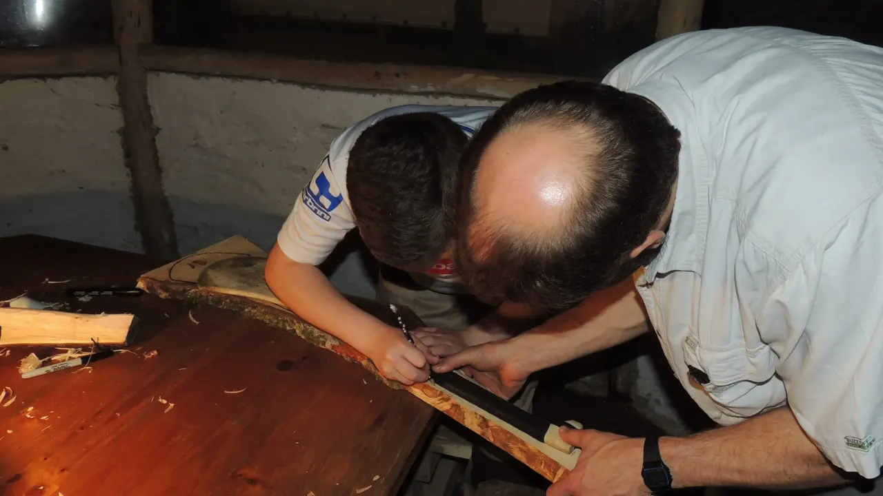 Boy making hurling stick