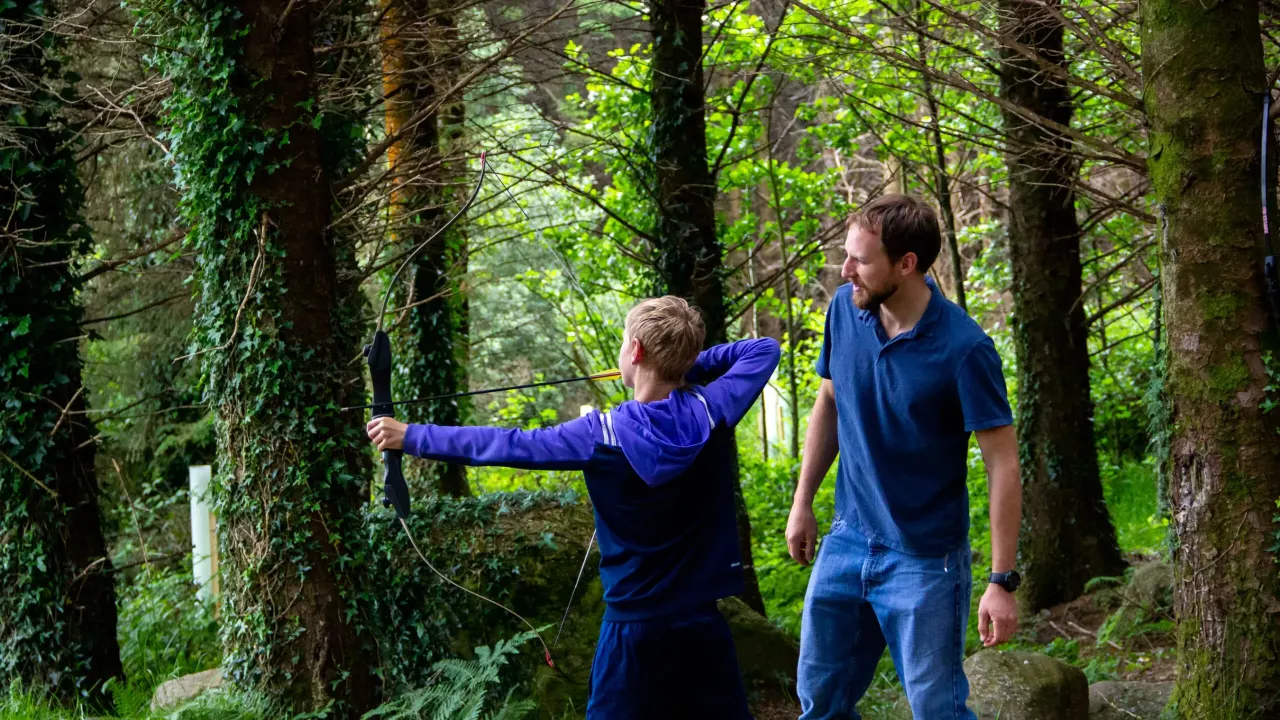 Boy learning archery